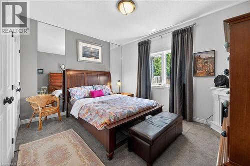 Primary bedroom features double closets, carpeting and electric fireplace. - 6 Gaddye Lane, Binbrook, ON - Indoor Photo Showing Bedroom