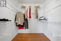 Primary bedroom walk -in closet - 