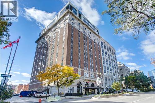 Historic multi-story building featuring a brick and stone facade - 112 King Street E Unit# Ph6, Hamilton, ON - Outdoor With Balcony With Facade