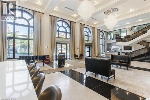 Grand foyer featuring high ceilings and extensive black and white checkerboard tile flooring - 112 King Street E Unit# Ph6, Hamilton, ON - Indoor Photo Showing Other Room