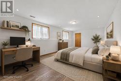 Rec room virtually staged as bedroom - 