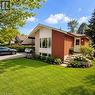 Brick exterior with stone accents and a carport - 82 Blackwood Crescent, Hamilton, ON 