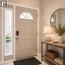 Entry door with an arched transom window and sidelight - 82 Blackwood Crescent, Hamilton, ON 