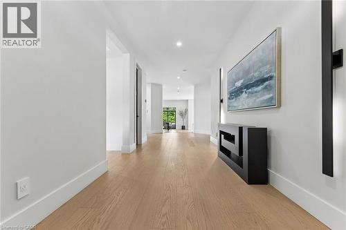 Foyer featuring premium oak wide plank wood-flooring, recessed lighting, and crisp white walls - 95 Pondcliffe Drive, Kitchener, ON 