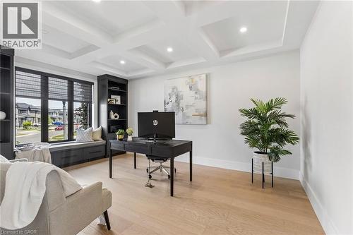 Premium oak flooring throughout provides a bright foundation for this room featuring a waffle ceiling with recessed lighting - 95 Pondcliffe Drive, Kitchener, ON 