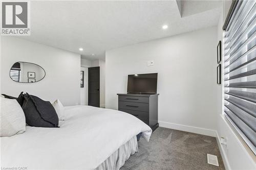 3rd bedroom on second storey with premium carpeting and Hunter Douglas blinds and ensuite bathroom - 95 Pondcliffe Drive, Kitchener, ON 