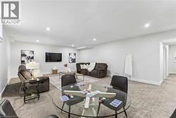 Living area in the basement with 9ft ceilings. - 