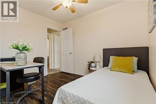 Well-lit interior room featuring wood-finish flooring, a ceiling fan, and light-toned walls - 17 Piper Place, Caledonia, ON 