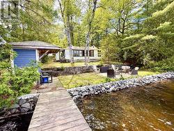 Cottage and waterside storage shed - 