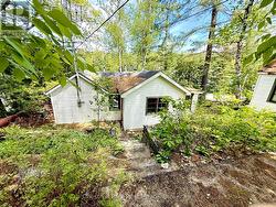 View to the cottage from the road level - 
