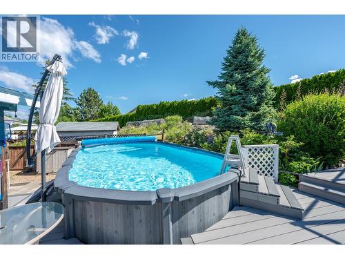 Above-ground pool - 6763 Meadows Drive, Oliver, BC - Outdoor With Above Ground Pool With Deck Patio Veranda