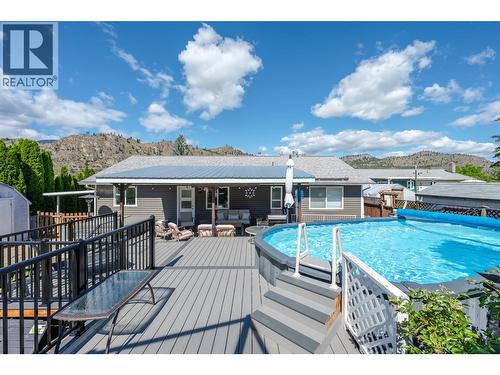 Back deck/platforms - 6763 Meadows Drive, Oliver, BC - Outdoor With Above Ground Pool With Deck Patio Veranda