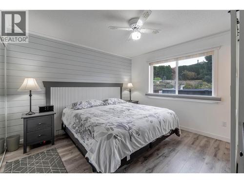 Primary bedroom - main level - 6763 Meadows Drive, Oliver, BC - Indoor Photo Showing Bedroom