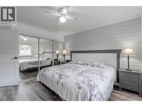 Primary bedroom - main level - 6763 Meadows Drive, Oliver, BC - Indoor Photo Showing Bedroom