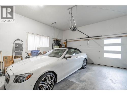 Double car garage - 6763 Meadows Drive, Oliver, BC - Indoor Photo Showing Garage