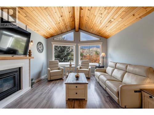 Living room - main level - 6763 Meadows Drive, Oliver, BC - Indoor Photo Showing Living Room With Fireplace
