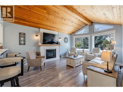 Living room - main level - 6763 Meadows Drive, Oliver, BC - Indoor Photo Showing Living Room With Fireplace