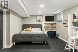 Finished interior space featuring recessed lighting, a drop ceiling, and neutral wall tones - 