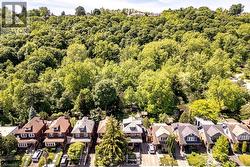 Aerial perspective showcasing properties backed by extensive natural woodlands - 