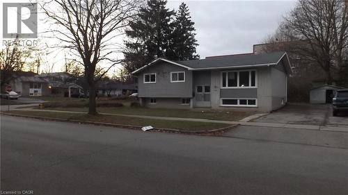 Split-level residence featuring a gray exterior with contrasting white trim - 68 Austin Drive, Waterloo, ON - Outdoor With Facade