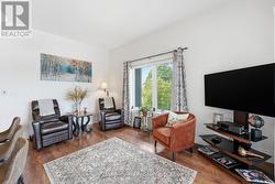 LARGE LIVING AREA WITH LARGE WINDOWS - 