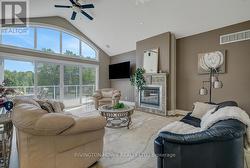 Great room with gas burning fireplace. - 