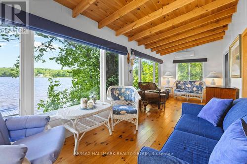 Bright sunroom with panoramic lake views - 118 Hall Shore Road, Lanark Highlands, ON 