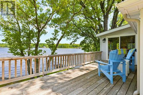Spacious deck with seating and lake views - 118 Hall Shore Road, Lanark Highlands, ON 