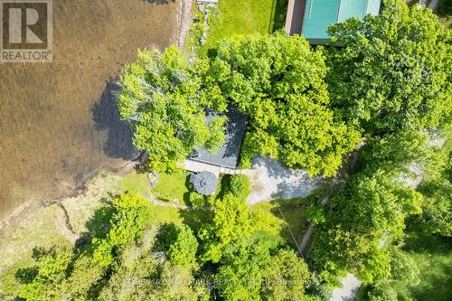 Peaceful shoreline with dock and calm waters - 118 Hall Shore Road, Lanark Highlands, ON 