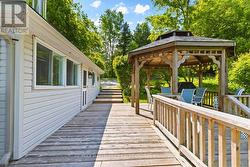 Wraparound deck connecting outdoor spaces - 
