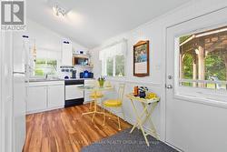 Bright kitchen with dining nook and access - 