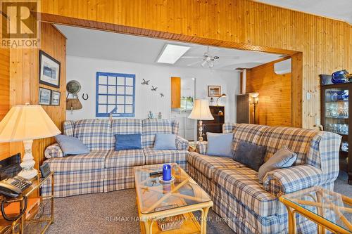 Inviting living room with wood accents - 118 Hall Shore Road, Lanark Highlands, ON 