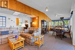 Spacious living and dining with wood detail - 