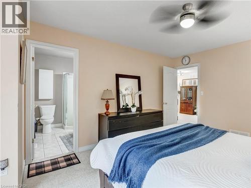 Neutral-toned room featuring a ceiling fan with integrated lighting - 2229 Walkers Line Unit# 6, Burlington, ON - Indoor Photo Showing Bedroom