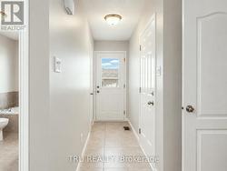 Door to deck & doors to the garage and Basement. - 
