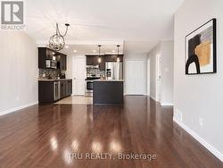 Open layout with pot lights & great light fixtures - 