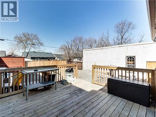 Expansive wood deck with natural wood railing and privacy fencing - 229 Parkdale Avenue N, Hamilton, ON 