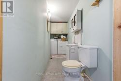 Powder room and laundry at rear entrance. - 