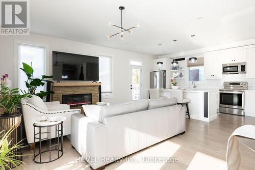 The fireplace is electric and is included. - 1 Princeton Common Street, St. Catharines (Lakeport), ON 