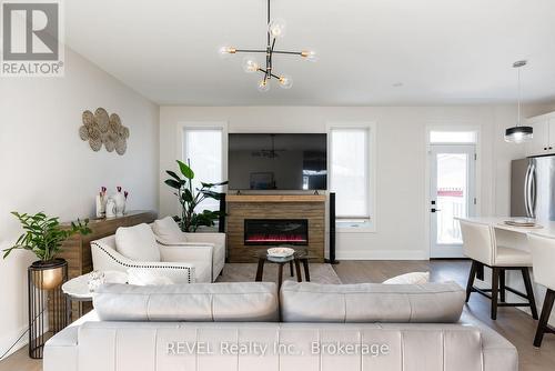 The sideboard mounts above the fireplace for a TV - 1 Princeton Common Street, St. Catharines (Lakeport), ON 