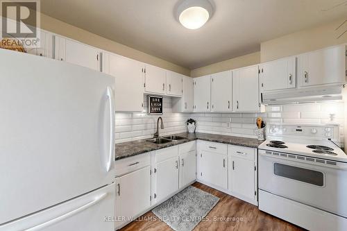 304 - 131 Taunton Road E, Oshawa, ON - Indoor Photo Showing Kitchen With Double Sink