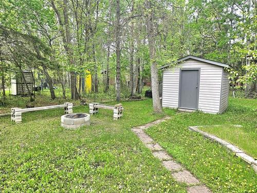 10'x10' storage shed and fire pit area - 6 Canoba Crescent, Gimli Rm, MB 