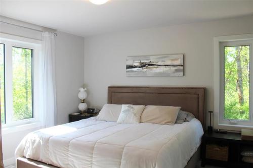Primary bedroom has two large windows, walk in closet as well as a four piece ensuite! - 7 Dalvik Road, Gimli Rm, MB 