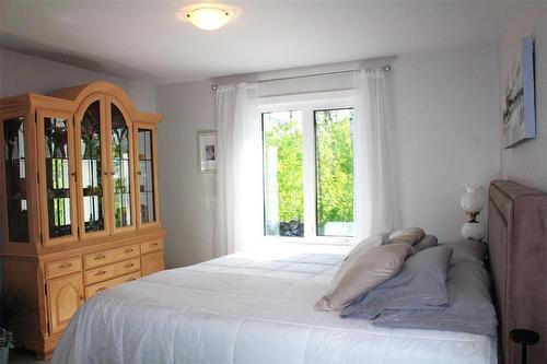 Another view of the primary bedroom. All the pictures have trees for your view... - 7 Dalvik Road, Gimli Rm, MB 