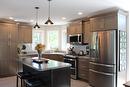 Beautiful cabinets and appliances. Microwave as a "bump out" for the fan. - 7 Dalvik Road, Gimli Rm, MB 