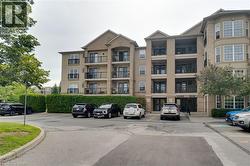 Multi-story residential building featuring a stucco exterior with stone accents and multiple private balconies - 