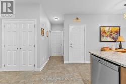 Coat closet on left, powder rm & laundry down hall - 