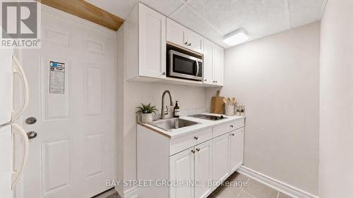 Basement Kitchen - AI Stage - 26 Innismore Crescent E, Toronto, ON 