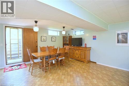 Open living space featuring patterned tile flooring and light blue walls - 372 Fennell Avenue W, Hamilton, ON 