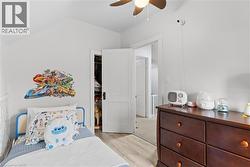Attic space featuring pitched ceilings and wood-finish flooring - 